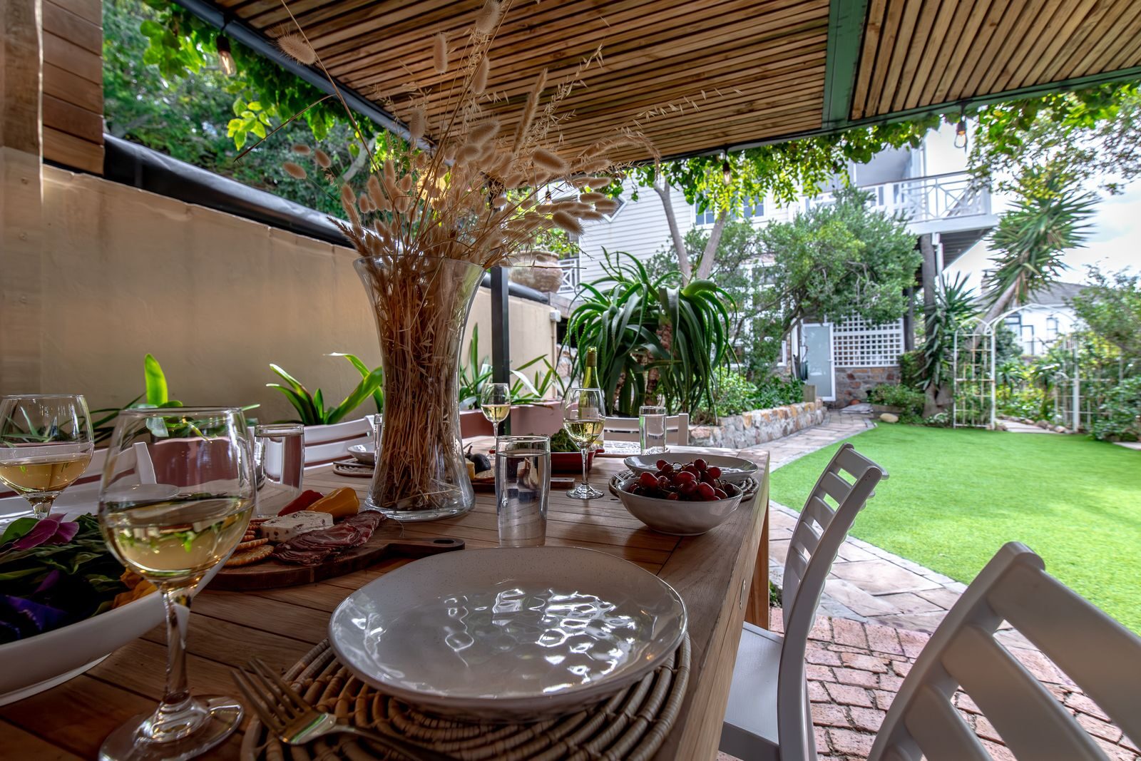 Lunch laid under the pergola, garden beyond