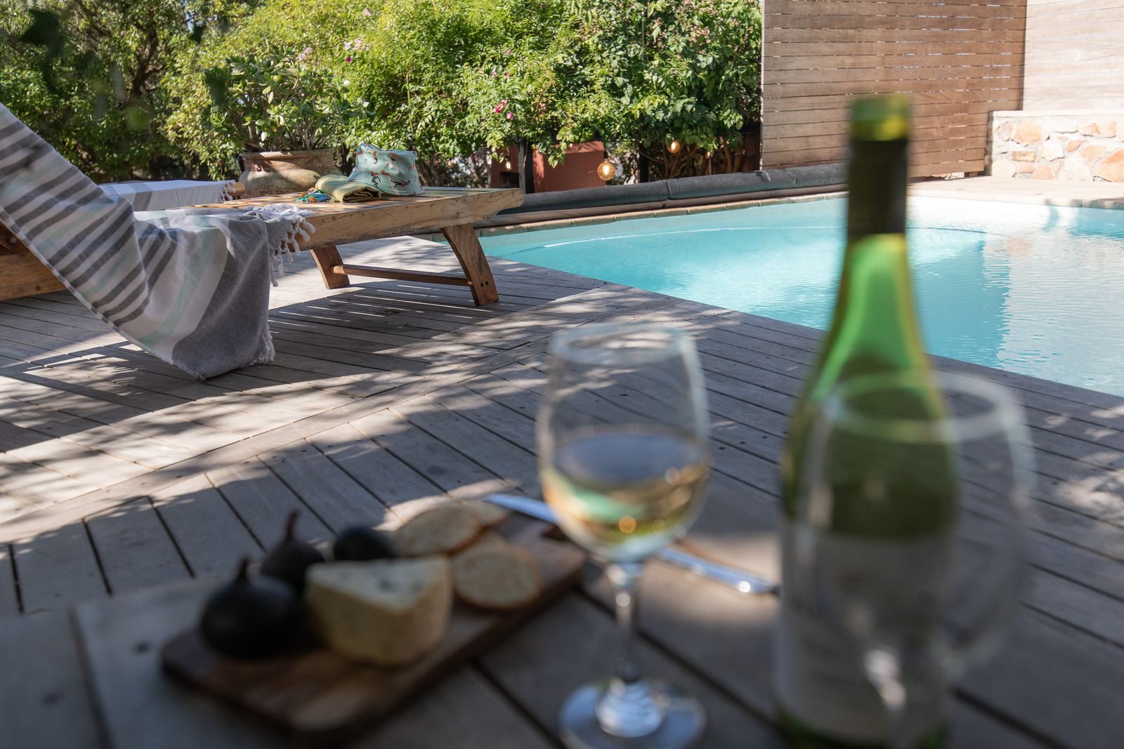Poolside: wine, cheese board and a lounger at the Muizenberg pool