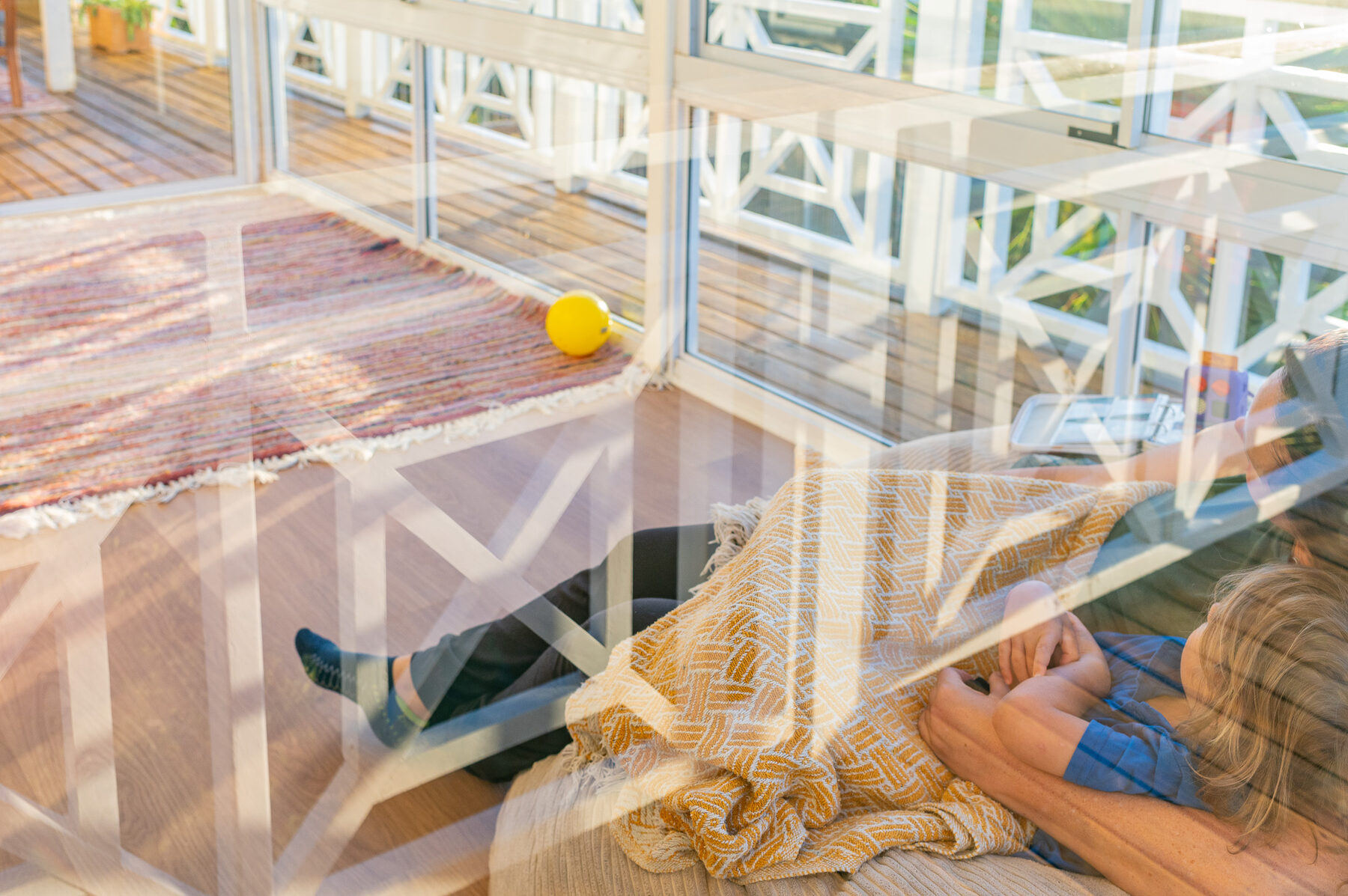 Golden light through a window lattice, reflections over the stoep