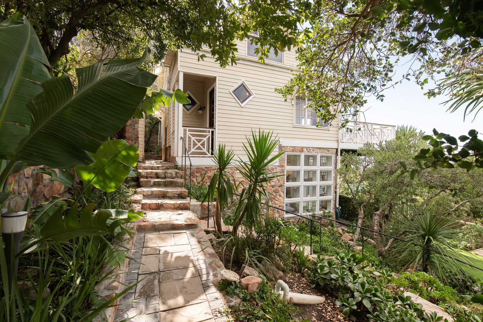Stone steps rising through the garden to the house